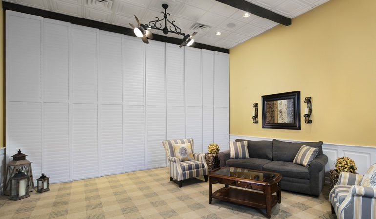 Plantation shutters as a room divider for a business